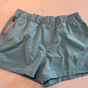Stio Second Light Teal Athletic Shorts with front pockets and side zip pocket.